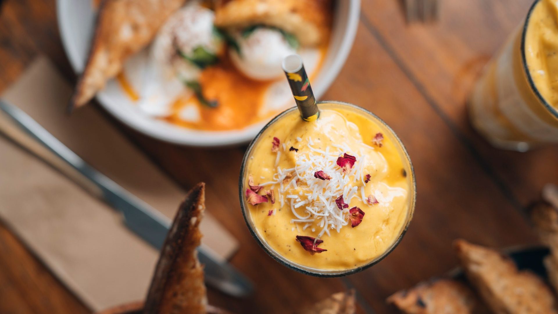 Glass of orange and white smoothie