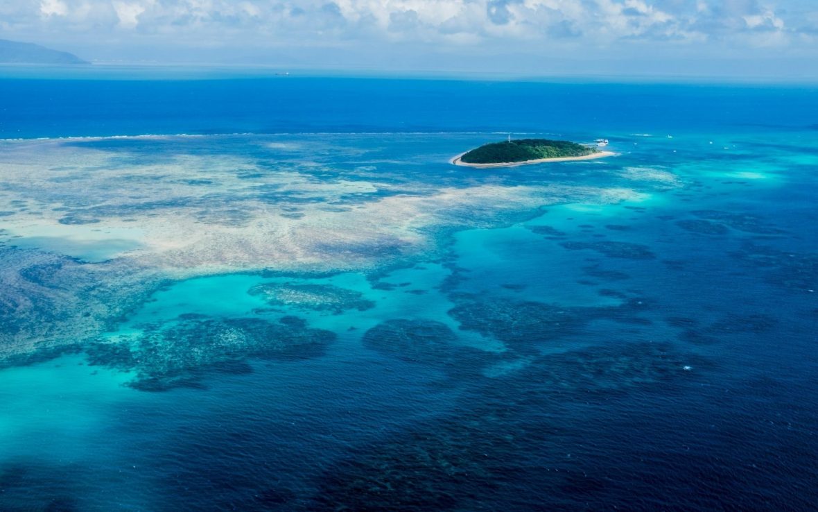 An aerial view of a reef and ocean