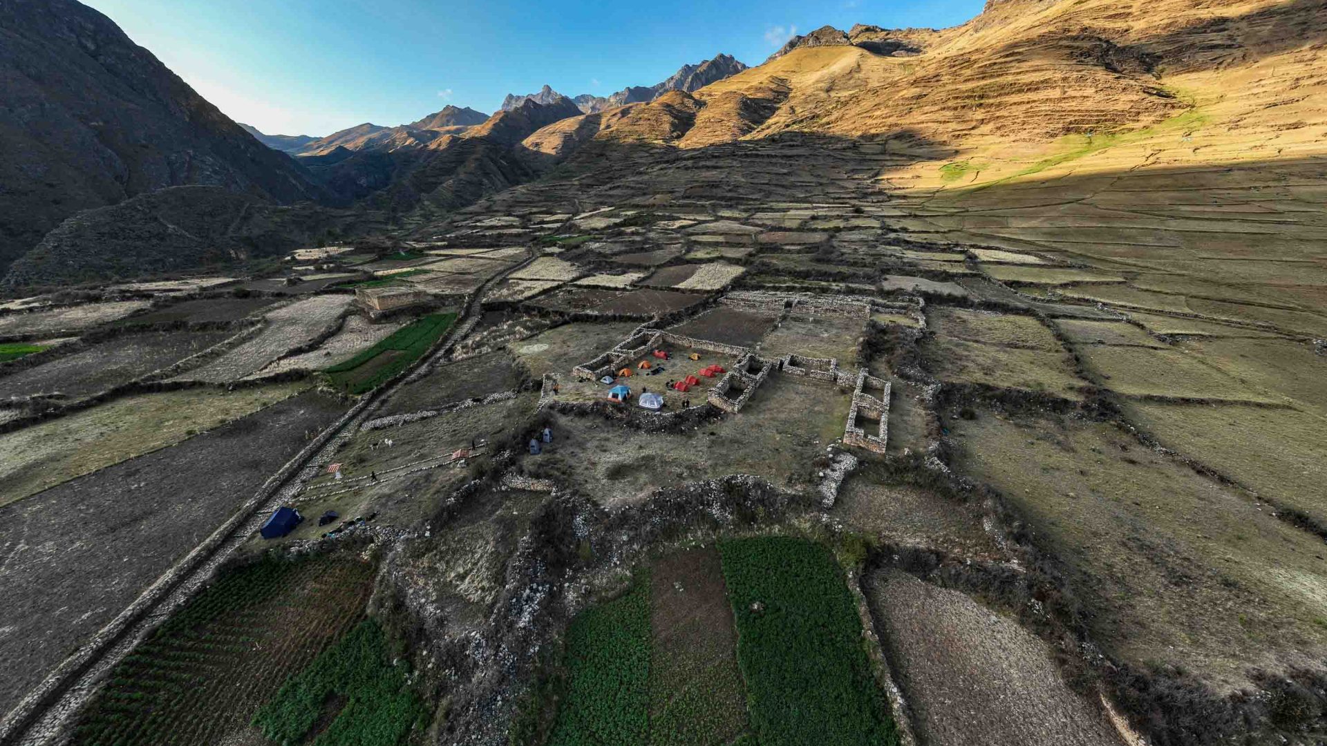 A drone photo of houses and valley.